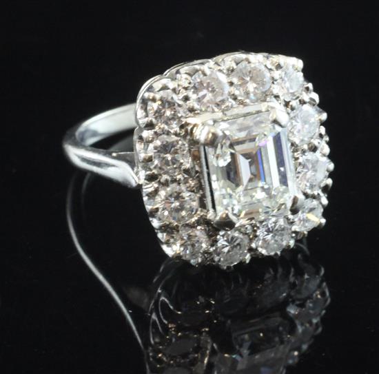 A 1940s/1950s 18ct white gold and diamond cluster ring, size P.